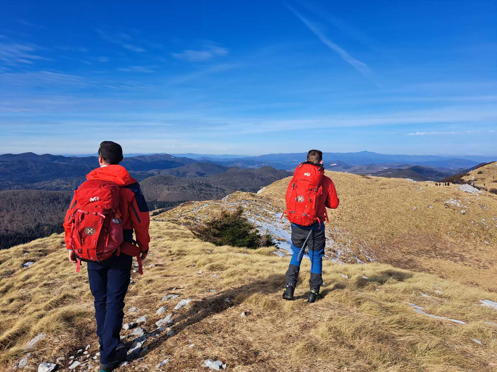 two hikers on a mountain top